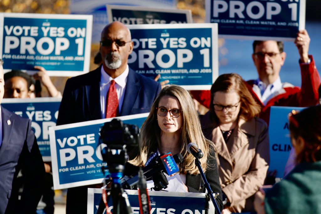 Erika at a rally advocating legislators to "Vote Yes to Prop 1"